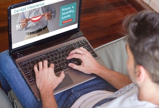 Man looking up dental insurance in Beverly Hills