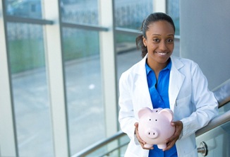 Dentist with piggy bank in Beverly Hills