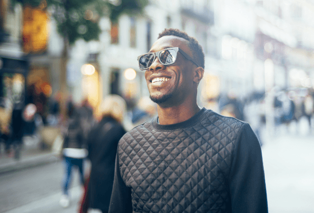 Man's flawless smile after metal free dental crown restoration