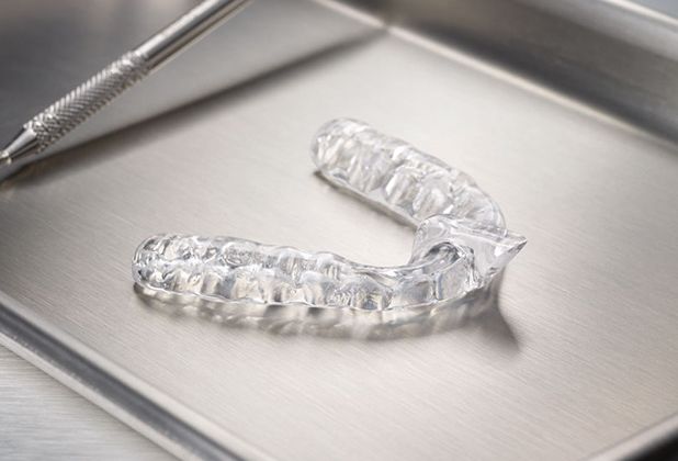 Clear nightguard for bruxism on metal tray
