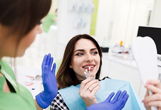 Dentist explaining cost of veneers in Beverly Hills