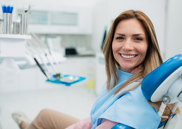 Cosmetic dentist in Beverly Hills comparing veneers to patient’s teeth