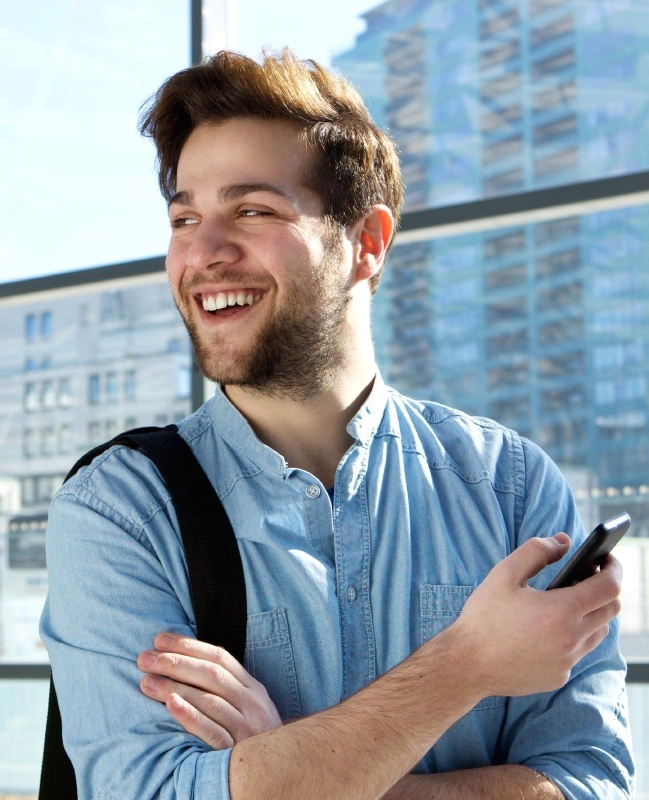 Man with healthy teeth and gums after periodontal therapy