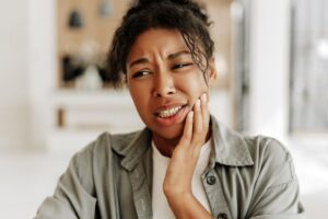 woman experiencing dental abscess pain